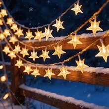 Create An Outdoor Starlit Night Scene With This Solar Star String Light, Available In 5M20LED, 7M50LED, 12M100LED Three Specifications, Soft Warm Light Is Gentle And Touching. Hollow Five-Pointed Star Design With Delicate Texture, Stars Arranged In A Staggered Pattern, Lighting Up With Soft And Misty Light And Shadow, As If The Starry Sky Fell Into The Courtyard. Comes With 8 Light Dynamic Modes, Constant, Flashing And Other Effects Can Be Freely Switched - Solar Star String Lights - View 6