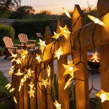 Solar Powered Warm White Star String Lights, 5M20LED, 7M50LED, 12M100LED Multiple Specifications Available, Ideal For Garden Holiday Decoration. Hollow 3D Five-Pointed Star Design, Exquisite Craftsmanship, Warm Yellow Soft Light Gently Radiating, Sparkling Stars Under The Night Sky, Romantic And Healing Atmosphere. Built-In 8 Lighting Modes, Multiple Lighting Effects Freely Switchable. - Solar Star String Lights - View 7