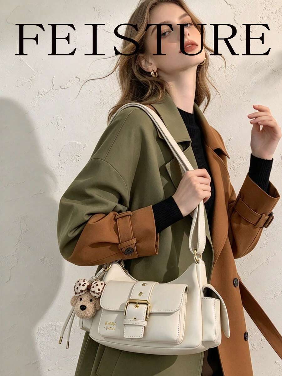 1个FEISTURE PU面料多口袋单肩斜挎包，拉链封口，吊坠装饰，适合女孩、女士、大学生、年轻职业人士，非常适合工作、商务、通勤和上学使用。