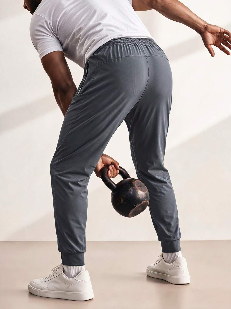 Driftmere Men's Fashionable Ice Silk Pants, Casual Running Sports Pants, Elastic Slim Fit Drawstring Trousers, Zipper Pockets Quick Dry Fitness Workout Pants - Grey - View 1