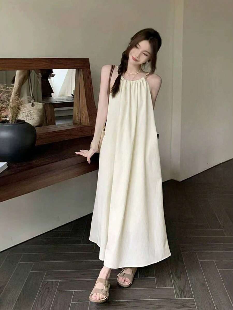 新款法式宽松露背吊带连衣裙,优雅休闲,尽显夏日风情 - 杏色 - 查看 1