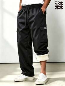 Mulinsen Men's Fleece Lined Cargo Pants, Winter Thickened Warm Straight Leg Multi-Pocket Drawstring Elastic Waist Casual Long Pants - Black - View 1
