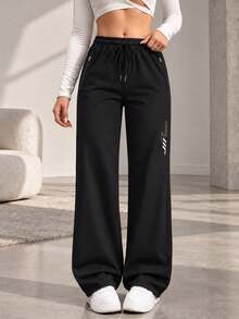 Women's Black Drawstring Jogger Pants With Zipper Pockets And Reflective Detail, Tapered Active Pants For Daily Wear - Black - View 4