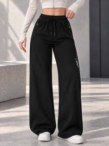 Women's Black Drawstring Jogger Pants With Zipper Pockets And Reflective Detail, Tapered Active Pants For Daily Wear - Black - View 9