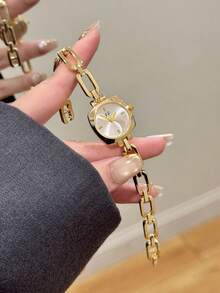 1件女款金色石英手錶 白色錶盤鏤空錶帶設計 極簡刻度標記 – 適合日常配戴 - 金色 - 查看 1