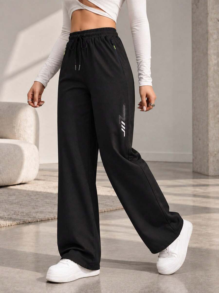 Women's Black Drawstring Jogger Pants With Zipper Pockets And Reflective Detail, Tapered Active Pants For Daily Wear - Black - View 1