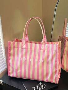 Tote Bag With A Square Body And Striking Vertical Stripe Design, Featuring A Minimalist Letter Logo On The Front For A Clean And Sophisticated Look. Large Interior Capacity For Easy Storage Of Personal Items, With A Short Handle For Convenient Carrying, Suitable For Daily Outings And Creating A Simple Yet Elegant Commuting Style. - Pink - View 6