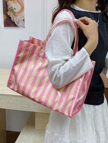 Tote Bag With A Square Body And Striking Vertical Stripe Design, Featuring A Minimalist Letter Logo On The Front For A Clean And Sophisticated Look. Large Interior Capacity For Easy Storage Of Personal Items, With A Short Handle For Convenient Carrying, Suitable For Daily Outings And Creating A Simple Yet Elegant Commuting Style. - Pink - View 3