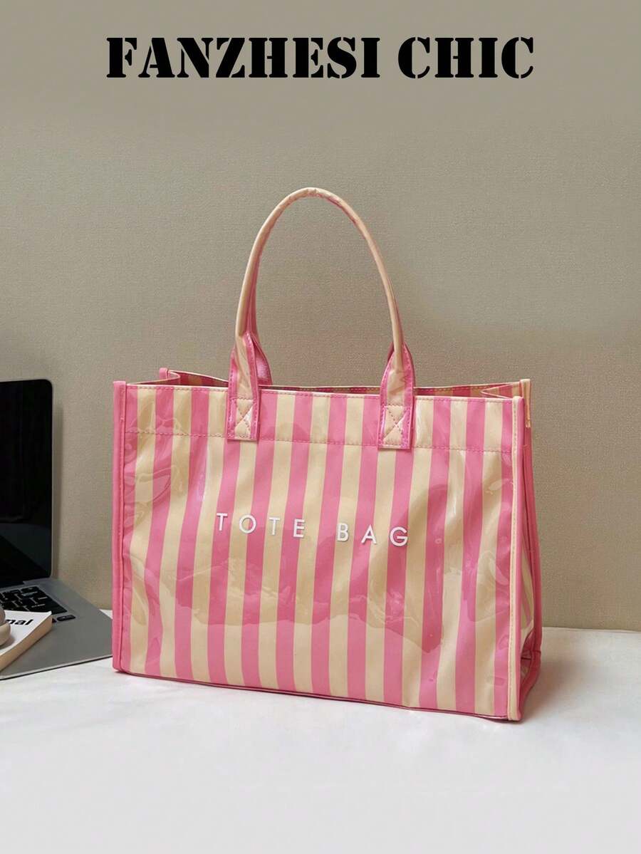 Tote Bag With A Square Body And Striking Vertical Stripe Design, Featuring A Minimalist Letter Logo On The Front For A Clean And Sophisticated Look. Large Interior Capacity For Easy Storage Of Personal Items, With A Short Handle For Convenient Carrying, Suitable For Daily Outings And Creating A Simple Yet Elegant Commuting Style. - Pink - View 1