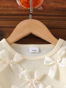 Baby Girl Cream Style Spring/Autumn 2-Piece Set, 3D Satin Bow Waffle Knit Patchwork Ruffle Hem Round Neck Ruffle Sleeve Pullover Top + Light Blue Frayed Hem Bow Denim Flared Long Pants, Low Saturation Gentle Style Baby Spring/Autumn Outfit Set - Apricot - View 4