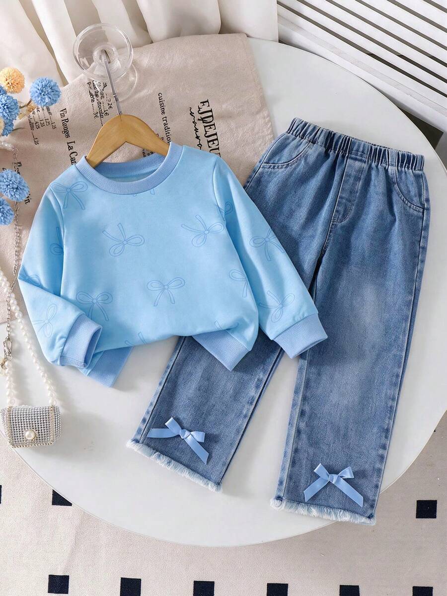 Fresh Korean Style Girls Spring/Autumn 2-Piece Set, Light Blue All-Over Print Bow Round Neck Long Sleeve Sweatshirt, Washed Light Blue Denim Flared Pants With Frayed Hem And Matching Satin Bow, Casual Outfit For Little Girls - Blue - View 1
