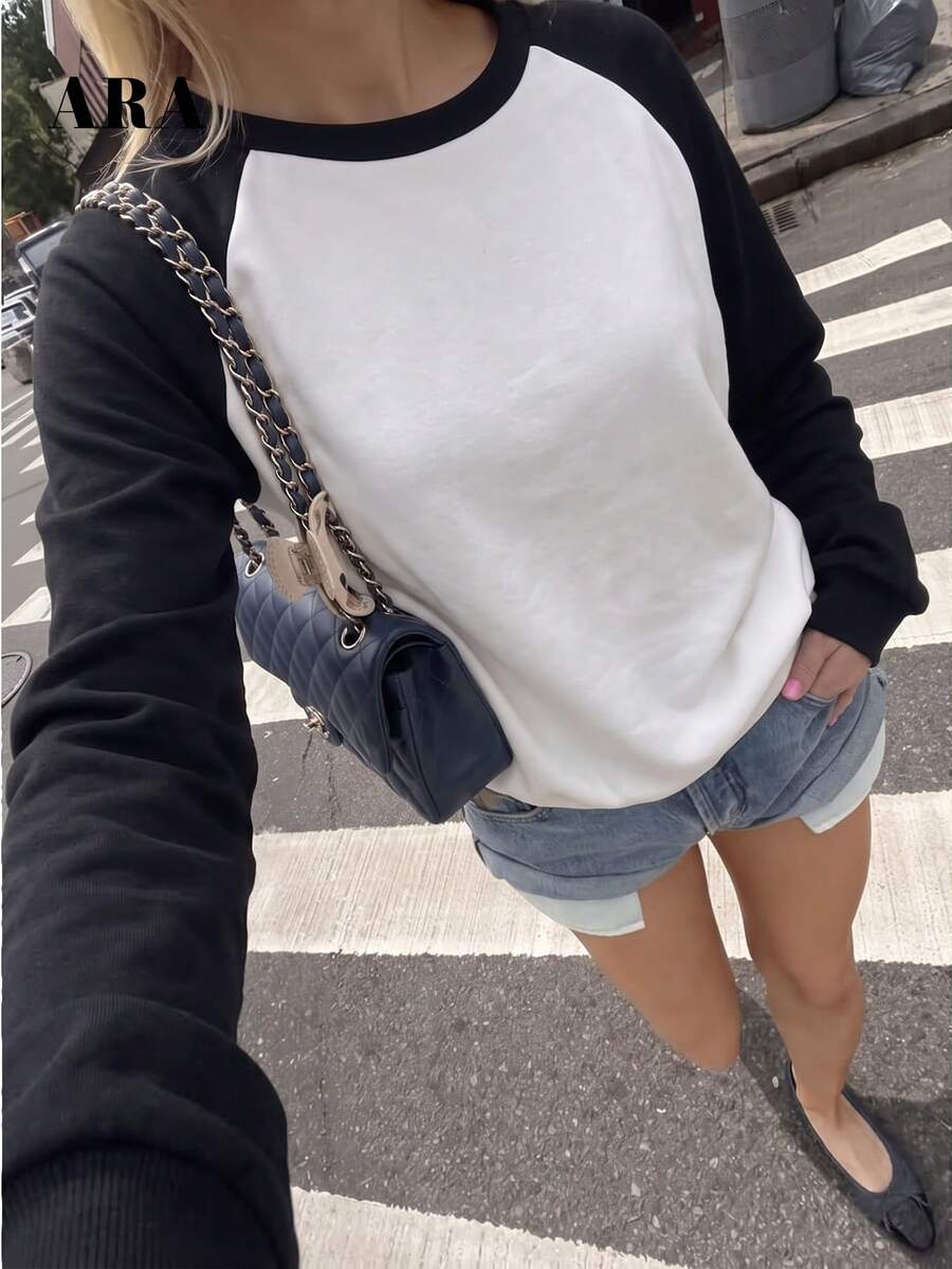 ARA CHIC Women's Autumn/Winter Raglan Sleeve Sweatshirt, Black And White Contrast Color Round Neck Long Sleeve Top, Loose Casual Pullover, Suitable For Daily Street And Date Outfits - Black and White - View 1