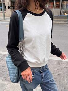 ARA CHIC Women's Autumn/Winter Raglan Sleeve Sweatshirt, Black And White Contrast Color Round Neck Long Sleeve Top, Loose Casual Pullover, Suitable For Daily Street And Date Outfits - Black and White - View 9