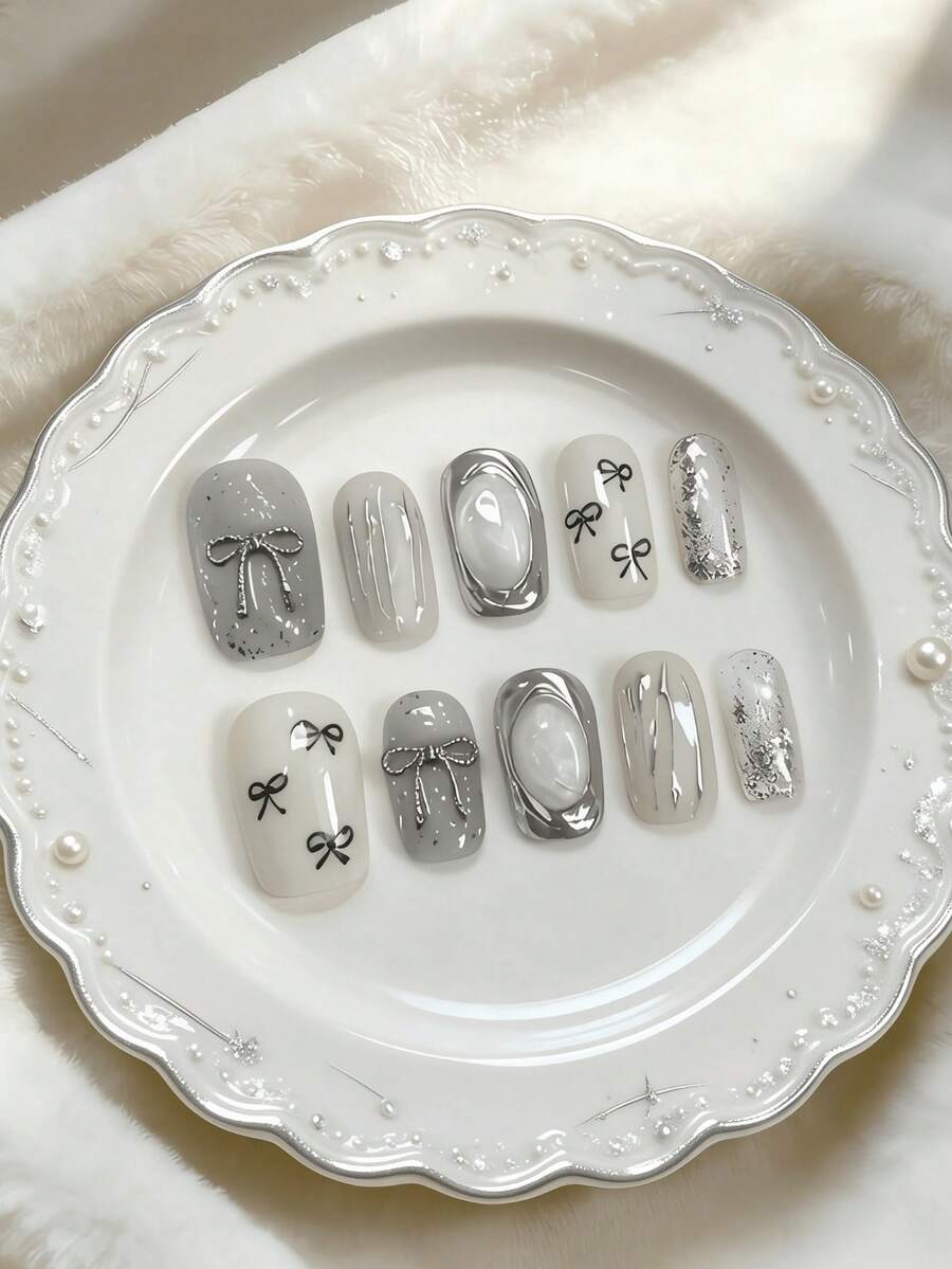 10pcs Medium Gray Silver Bow Nail Stickers, Minimalist Elegant Style, Featuring Bow And Line Patterns, Using Nude Tie Dye And 3D Decorative Techniques, Suitable For Young And Mature Women, Applicable For Workplace, Formal Dates, And Refined Parties, Comes With Jelly Gel And Nail File - Silver - View 1