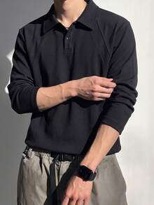 1pc Men's Black Polo Shirt, Turn-Down Collar, Double-Button Half-Placket, Raglan Ribbed Patchwork, Loose Curved Hem, Minimalist Mature Style, Long Sleeve, Suitable For Daily Commute, Street, Casual Outings - Black - View 1