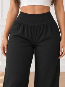 Pantalón de pierna ancha para mujer, casual y deportivo. Ajuste de cintura alto. Sin bolsillos. Interior fresco y cómodo, ideal para el uso diario. Colores lisos sin estampado. - Negro - Ver 4