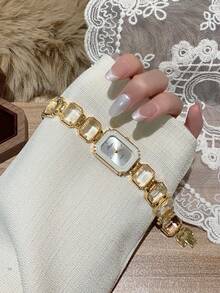 Đồng hồ nữ màu vàng thời trang với dây đeo đính đá rhinestone trắng, mặt vuông tối giản với vạch giờ, phù hợp đeo hàng ngày - Vàng - Xem 3