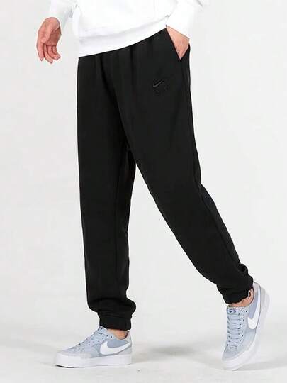 Quần tập thể thao nam Nike màu đen trơn, in logo, chất liệu dệt kim, bo gấu, vải terry