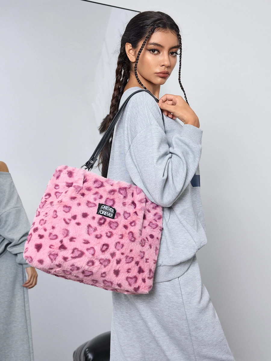 DareSee 柔软蓬松的粉色豹纹毛绒手提包，饰有金属环，容量大，适合女性日常使用，尤其适合女孩、女士、大学生、职场新人及白领在秋冬季节使用。这款包包是秋季必备单品，温暖舒适，完美搭配各种秋季女装。时尚的猎豹纹钱包，是秋冬必备的毛绒包，也是馈赠佳品。此外，它还带有豹纹元素，适合音乐节等场合。 - 粉色 - 查看 1