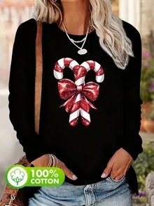 Maglietta casual da donna taglia grande in 100% cotone, con motivo natalizio di bastoncini di zucchero rossi e bianchi, scollo tondo, adatta per tutti i giorni. Maglietta da donna con stampa a fiocco. Maglietta a maniche lunghe da donna con stampa atmosfera natalizia. Maglietta a maniche lunghe con stampa di caramelle scintillanti e fiocchi. - nero - Visualizzare 1