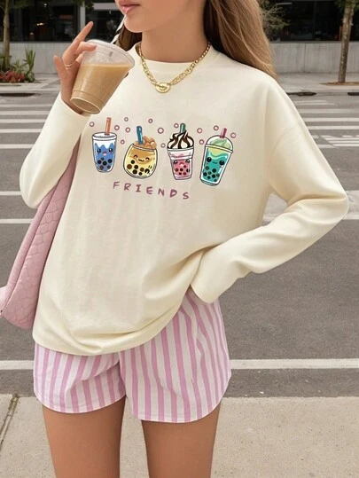 1件少女休闲印花长袖T恤，时尚保暖舒适，适合年轻学生，春秋季穿着。