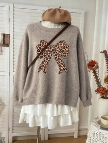 Suéter de punto de manga larga con cuello redondo y diseño de lazo con estampado de leopardo único, cómodo y elástico, estilo de punto falso para mujer de talla grande - Camel - Ver 1