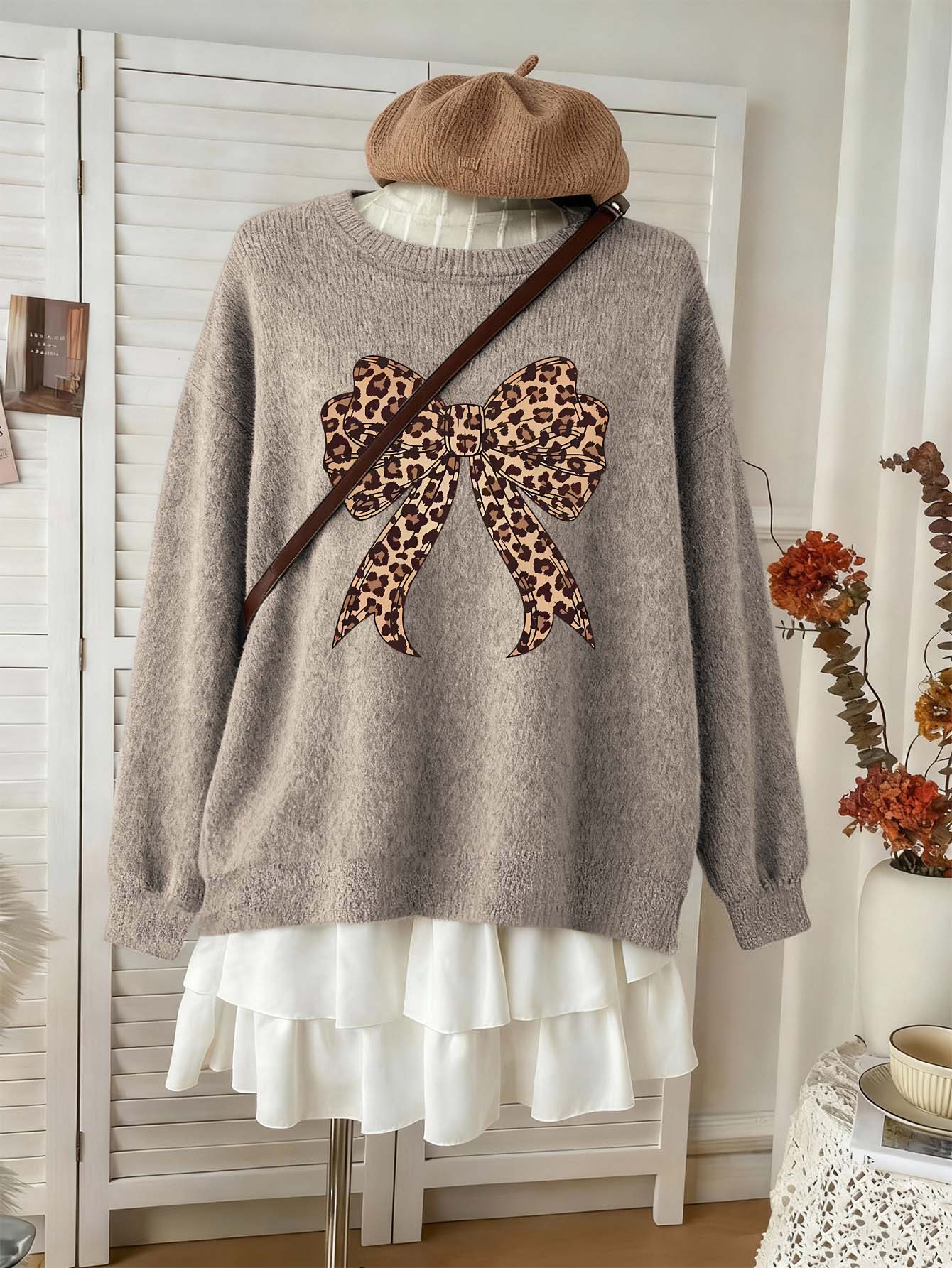 Suéter de punto de manga larga con cuello redondo y diseño de lazo con estampado de leopardo único, cómodo y elástico, estilo de punto falso para mujer de talla grande - Camel - Ver 1