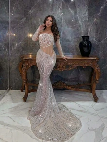 Đầm dạ hội sang trọng Astony, được trang trí bằng sequin, tua rua và ngọc trai, với thắt lưng xương cá, cổ tay áo đính sequin và chân váy đuôi cá quyến rũ. Thích hợp cho lễ hội hóa trang, đám cưới, lễ đính hôn, tiệc sang trọng, lễ hội âm nhạc và tiệc sinh nhật. - trắng - Xem 2