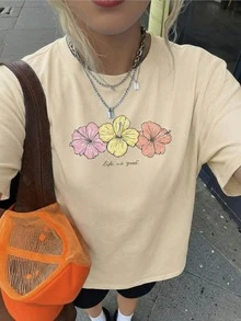 Camiseta de manga corta con cuello redondo, estampado de hibisco y eslogan colorido, nuevo estilo de verano para mujer. Estilo retro suave, llamativo y cómodo, adecuado para el campus - Albaricoque - Ver 2