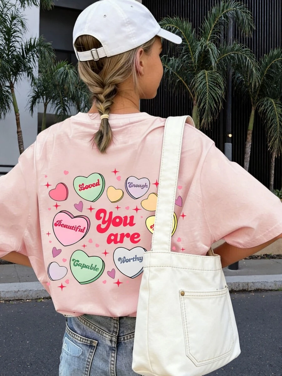 一件印有积极标语的短袖T恤，适合自信少女的夏季休闲图案T恤，适合青少年和学生穿着。 - 粉色 - 查看 1