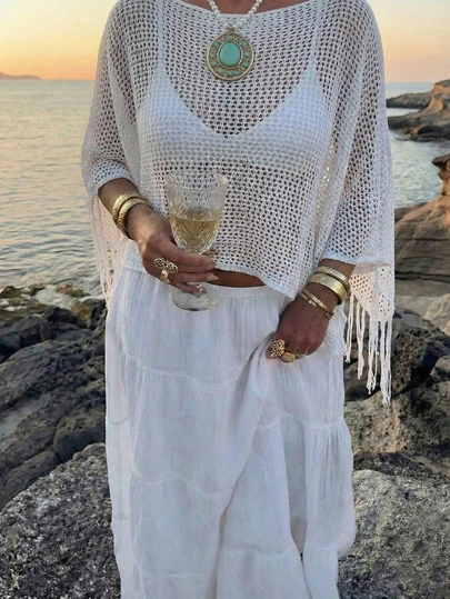 New Summer White Knit Top With An Openwork Hem And An Asymmetrical Cut. This Loose-Fitting, Figure-Flattering Top Features A Fringed Hem And A Bohemian Style, Making It Perfect For Beach Vacations, Getaways, Holiday Trips, Beach Parties, Casual Dates, Stylish Leisure Wear, And Graduation Ceremonies
