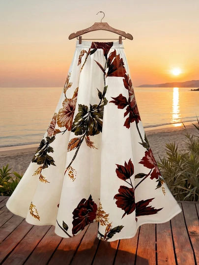 女士夏季度假风印花高腰A字长裙，飘逸宽松及膝，优雅迷人，适合度假和日常休闲穿着。