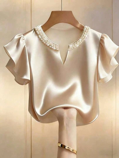 Áo kiểu nữ cỡ lớn bằng satin đính ngọc trai, cổ chữ V, tay bồng, thích hợp cho mùa hè.