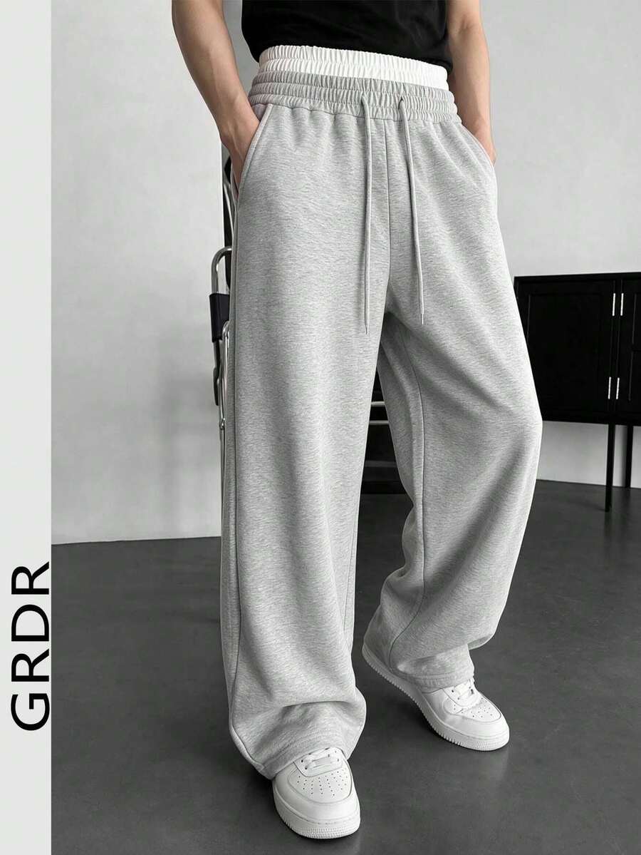 بنطال كاجوال رجالي GRDR بتصميم خصر مزدوج وخصر مطاطي مع رباط، قماش مريح وقصة فضفاضة منسدلة بأسلوب كسول وساق واسعة - رمادي فاتح - مشاهدة 1