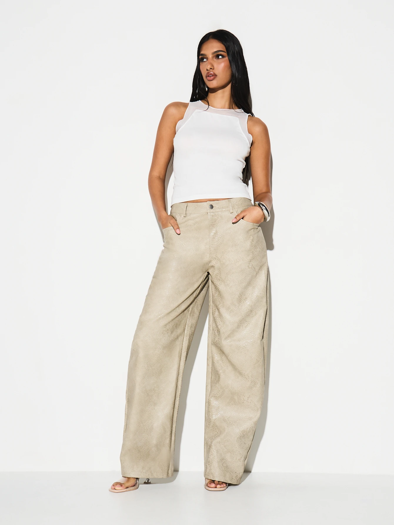 KIZN Pantaloni a gamba larga in similpelle con stampa serpente