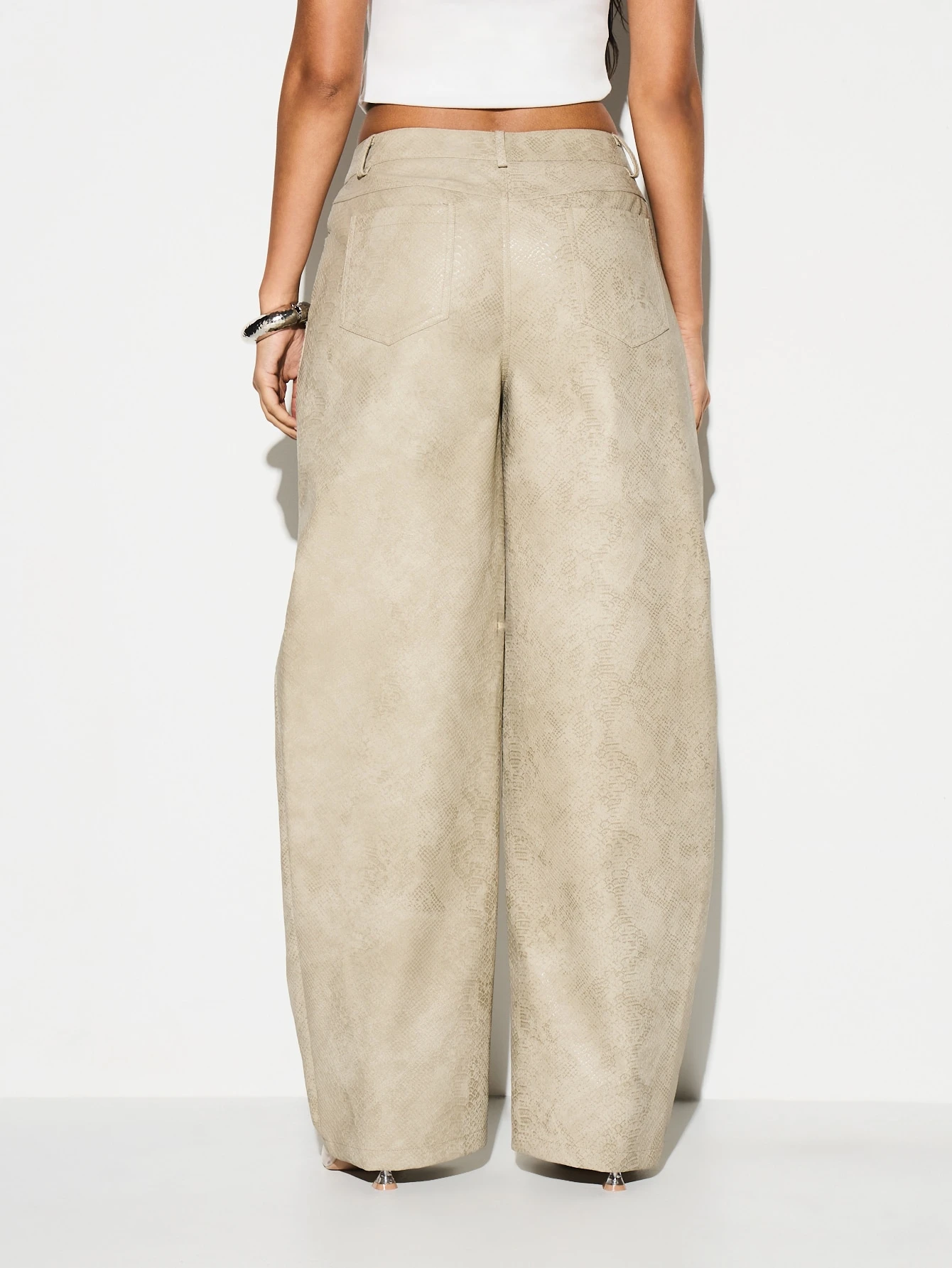 KIZN Pantaloni a gamba larga in similpelle con stampa serpente