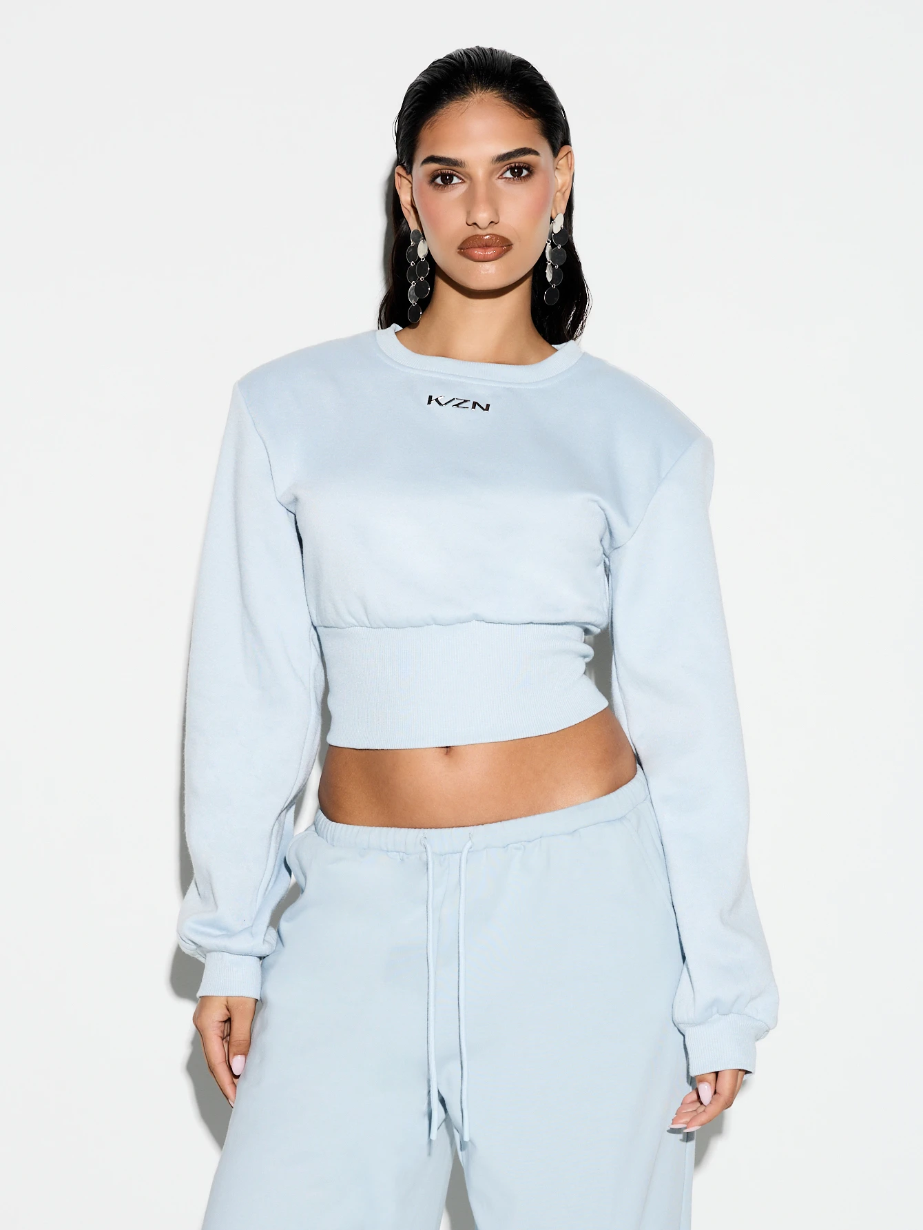 KIZN Sudadera azul claro con hombreras y cintura ceñida