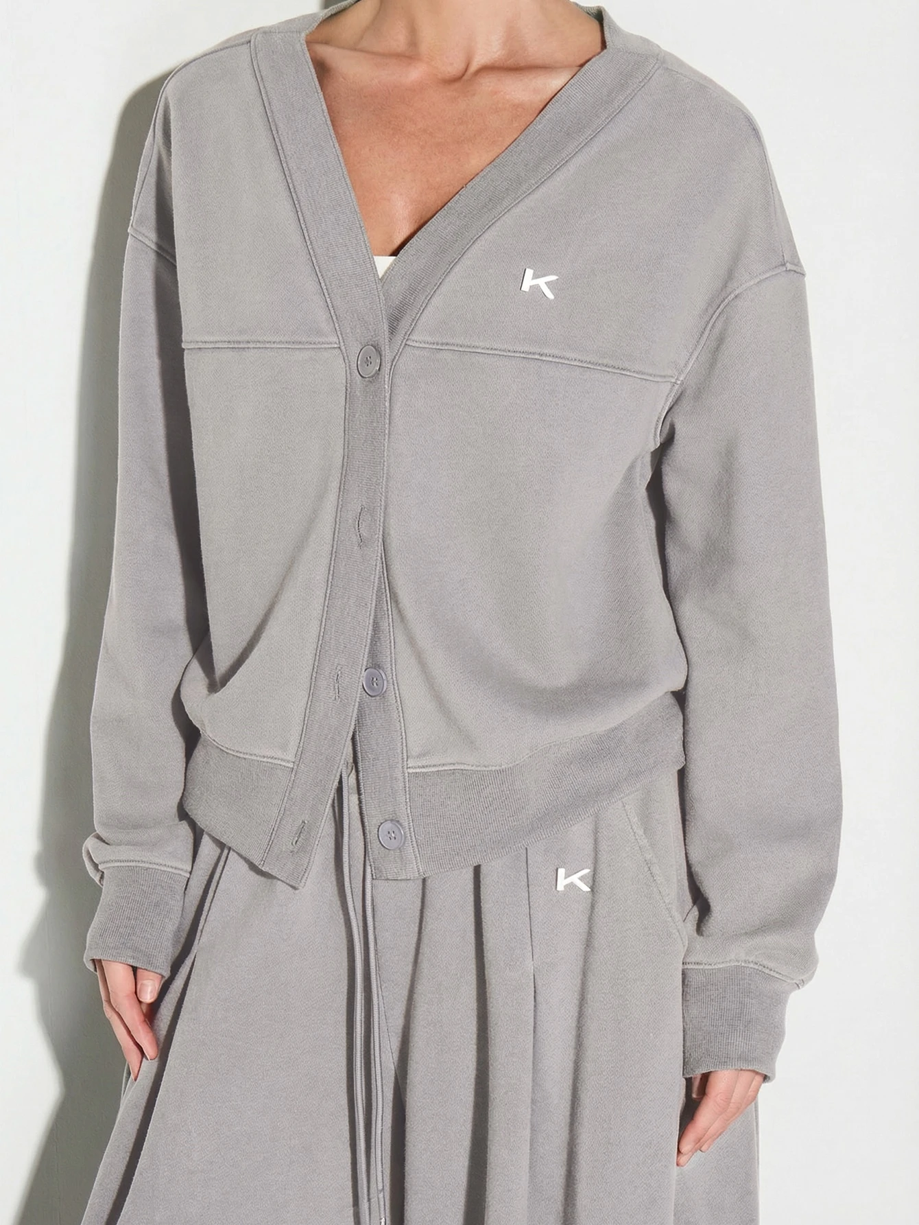 KIZN Strickjacke mit Knopfleiste und Metalllaschen