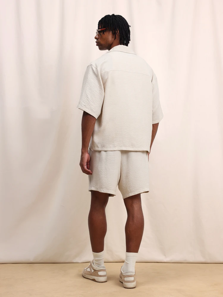 Beige Relaxed Fit Short Sleeve Shirt And Matching Shorts Co-Ord Set With Button Front Closure And Elastic Waist Summer Casual Two Piece Outfit