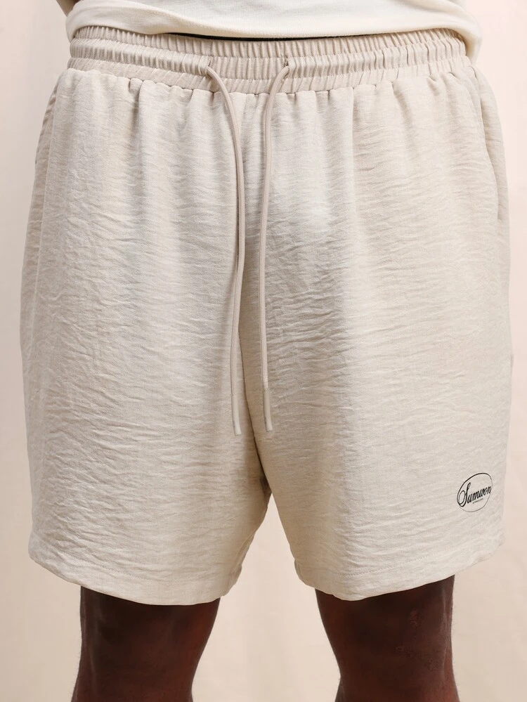 Beige Relaxed Fit Short Sleeve Shirt And Matching Shorts Co-Ord Set With Button Front Closure And Elastic Waist Summer Casual Two Piece Outfit