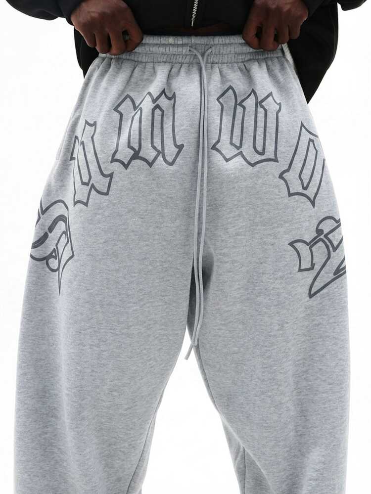 Pantalon de jogging ample pour hommes avec graphiques gothiques sur l'entrejambe, streetwear décontracté et confortable pour l'automne et l'hiver