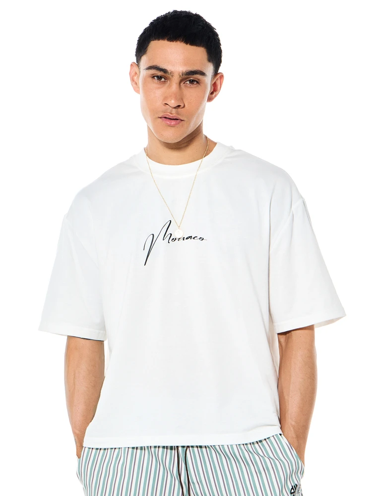 Monaco International Casual Box Fit Short Sleeve Crew Neck Printed T-Shirt Boat Graphic Text Design Summer Vacation Tee
