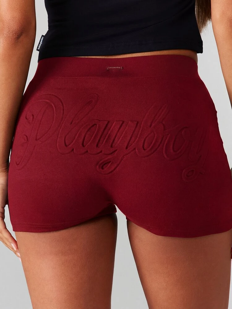 Missguided x Playboy Embossed Logo Booty Shorts With High Rise Waist And Stretchy Fit For Casual Summer Days