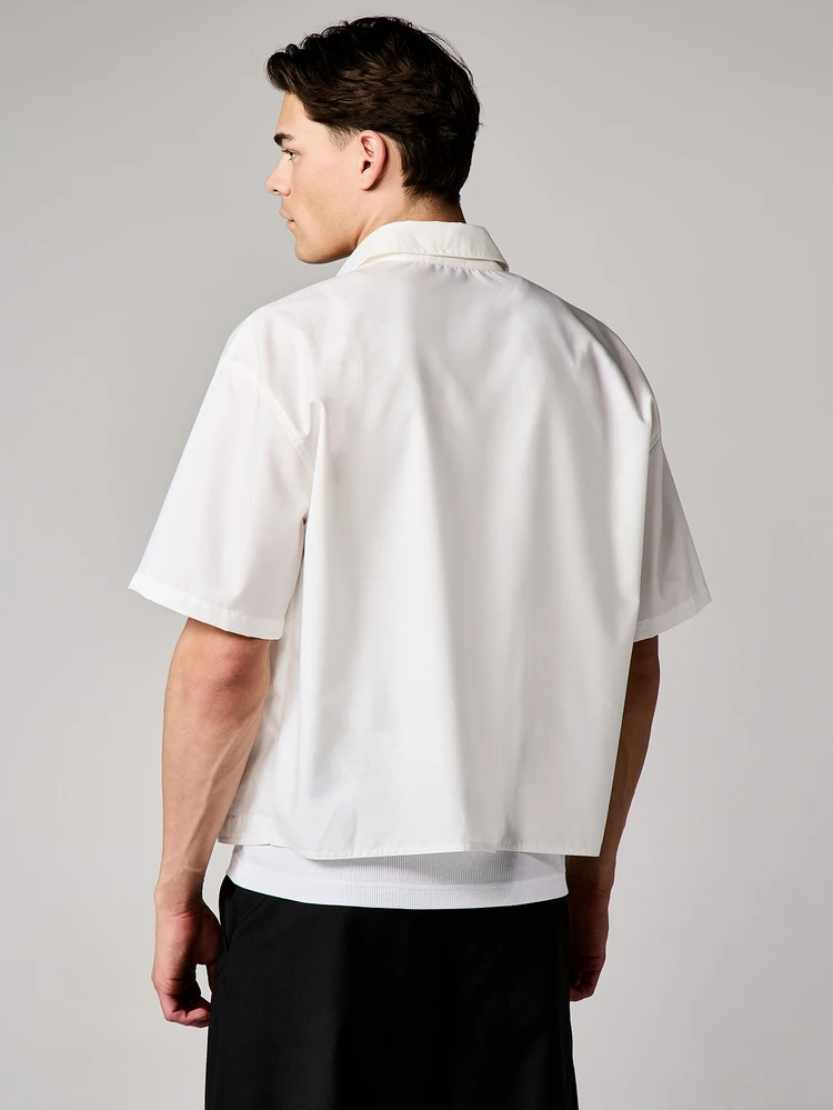 Boxy Fit Button Down Short Sleeve Shirt With Curved Hem And Embroidered Branding Details For Casual Relaxed Summer Style