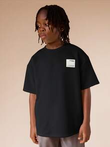 SUMWON Camiseta de verano oversize para niños con parche de logo blanco, camiseta de manga corta informal para preadolescentes - Negro - Ver 4