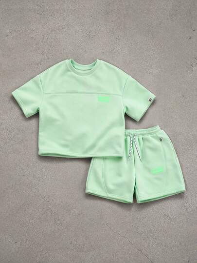 SUMWON Bộ đồ thể thao rộng rãi màu xanh lá nhạt gồm áo thun và quần short cho bé trai, kiểu dáng thường ngày mùa hè, cổ tròn, tay ngắn, dáng jogger có dây rút.