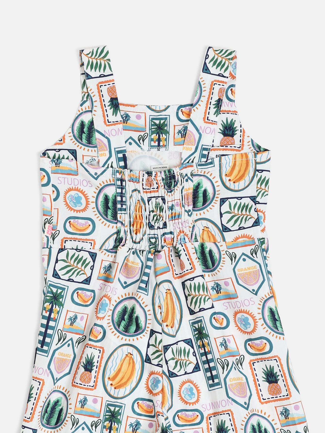 Jumpsuit mit tropischem Muster, langen Ärmeln und geradem Bein, mit Papaya-Ananas-Grafiken und Rüschendetails am Saum