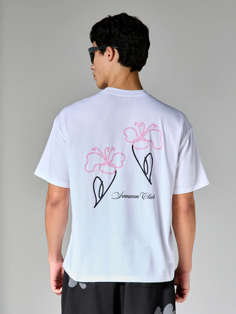 T-shirt a girocollo con maniche corte, con stampa floreale e design con testo "Summer Club", vestibilità regular in cotone