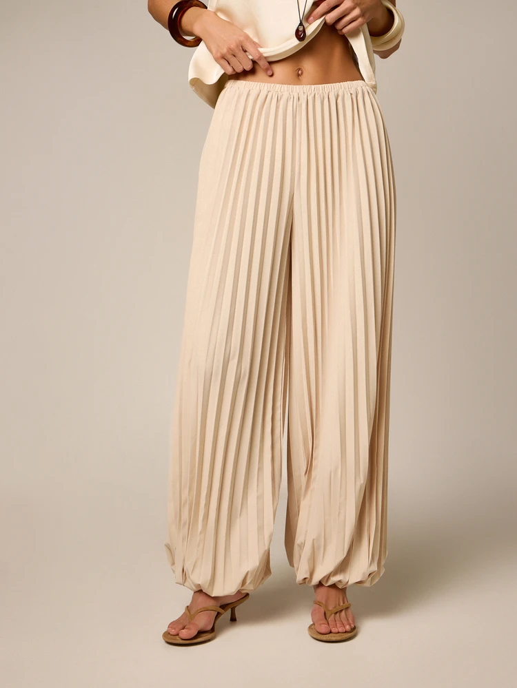 Pantalones palazzo plisados de pierna ancha