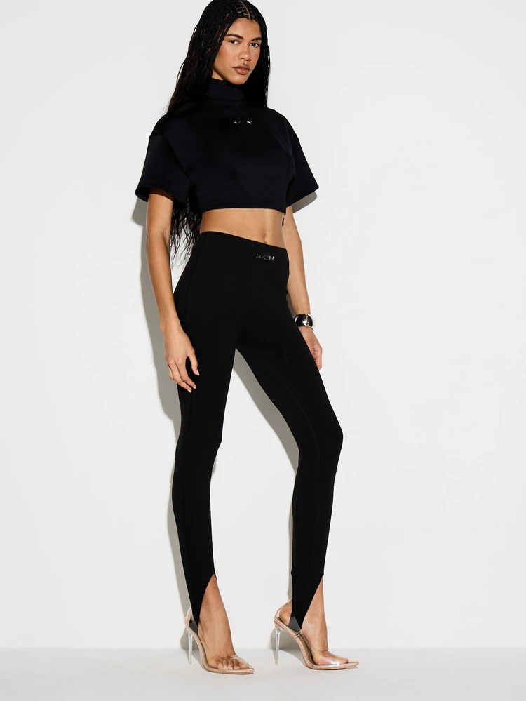 KIZN Calça legging de cintura alta com estribo e fenda frontal na barra.